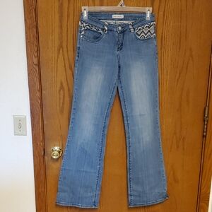 Light Wash Flare Jeans with Embroidered Trim